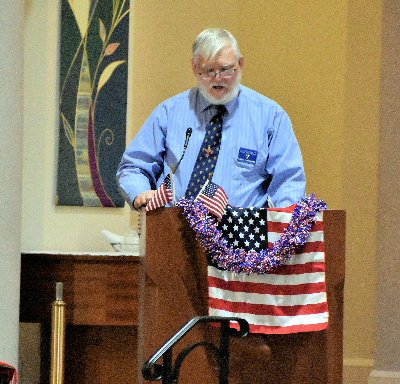 Past Grand Knight and Worthy Navigator Eddie Willams Reading during the Patriotic Rosary